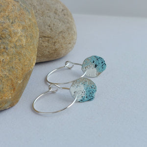 Sterling silver hoop earrings with powder coated colours in blue, white and black to portray lichens.