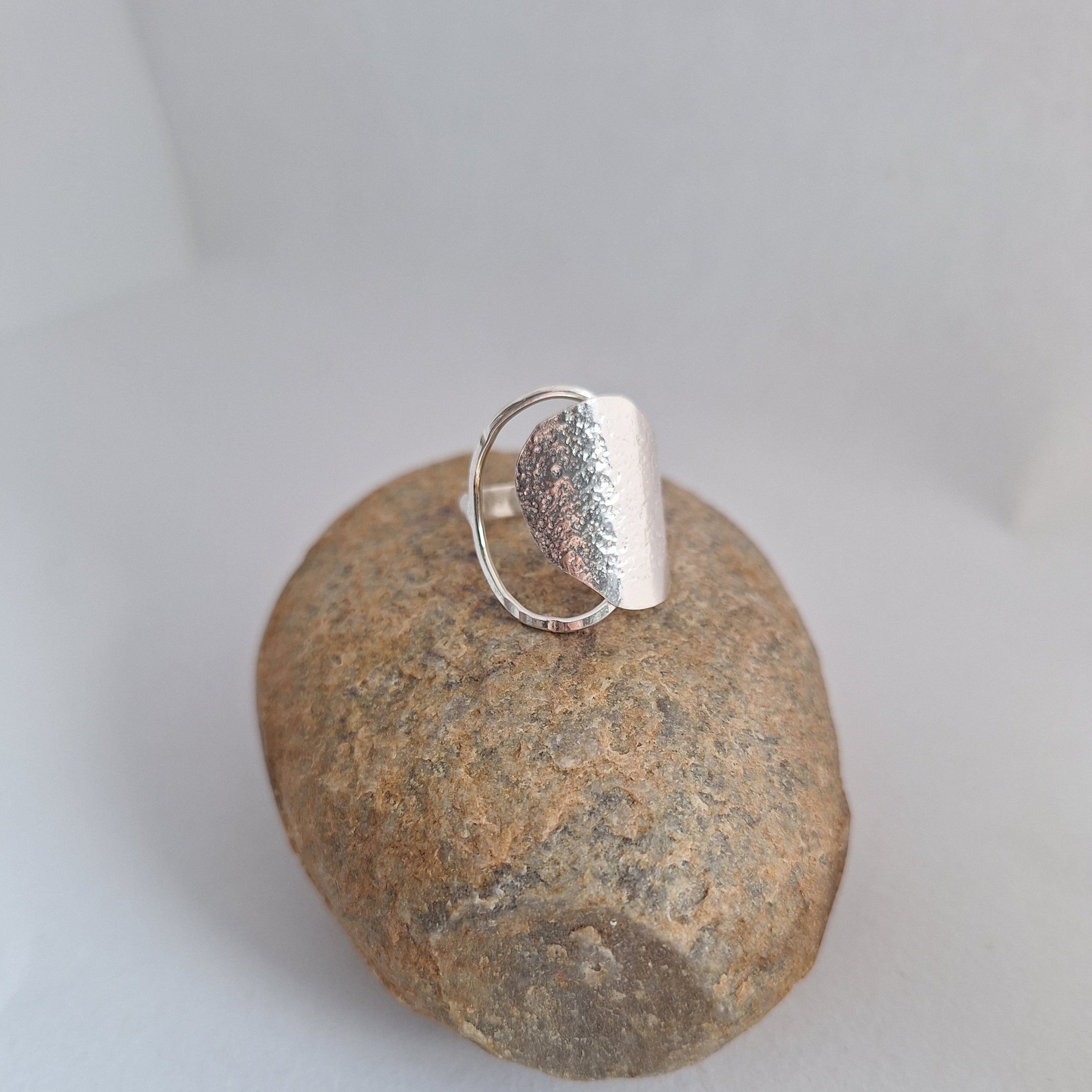 Sterling Silver Beach Boulder ring in sterling silver on rock.