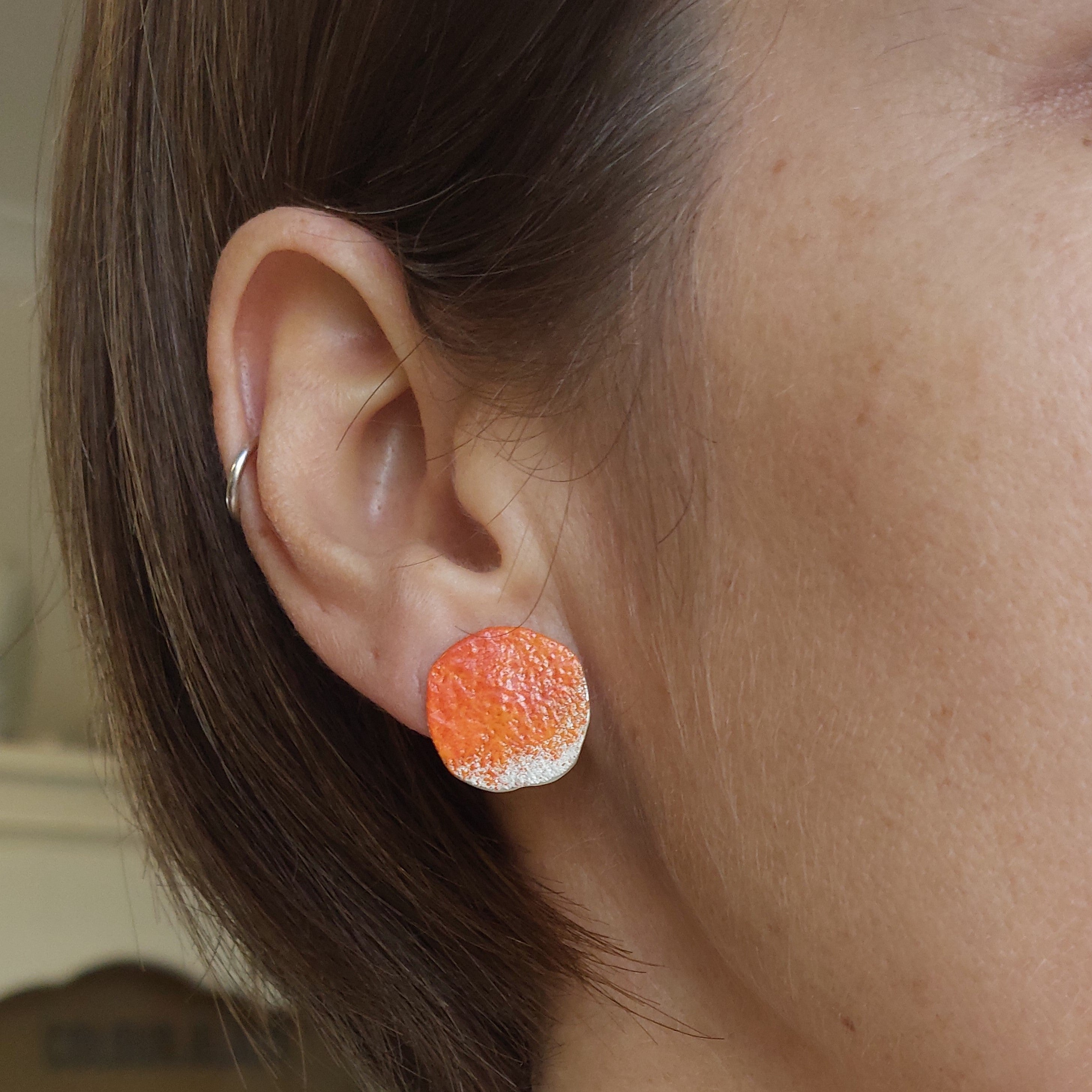 Sterling silver stud earrings with a rock texture and orange powder coat inspired by the lichens of the Bay of fires. Adjustable chain. Handmade in Tasmania by Karen Visagie from Hulley Jewellery