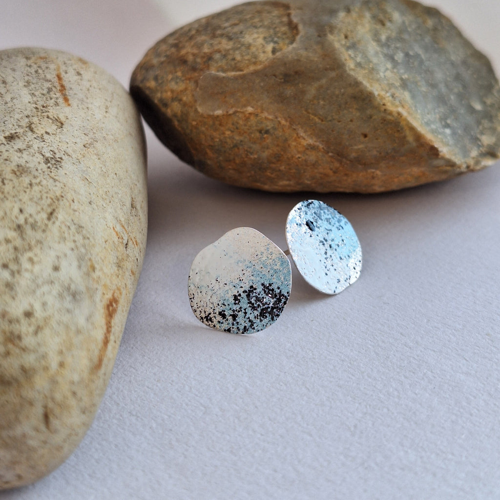 Sterling Silver beach rock lichen inspired stud earrings with blue, white and black powder coating. Handmade in Tasmania by Karen Visagie from Hulley Jewellery