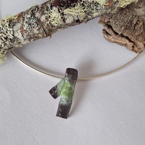 Sterling silver lichen inspired branch necklace with green powder coated lichen details.