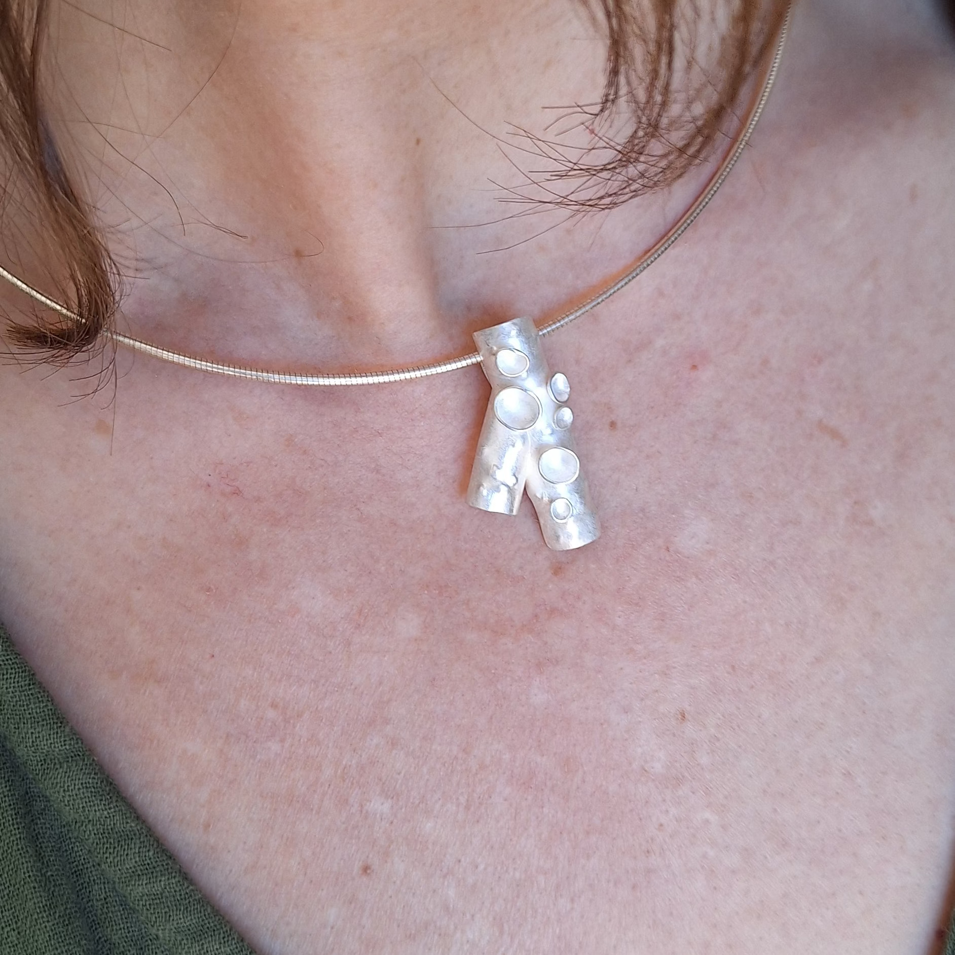 Sterling silver forest lichen inspired branch necklace with frosted finish on model