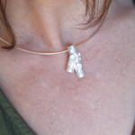 Load image into Gallery viewer, Sterling silver forest lichen inspired branch necklace with frosted finish on model
