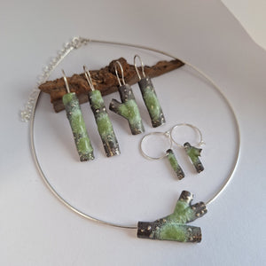 Frosted or blackened sterling silver hoop earrings with domed lichen cup or green powder coated details inspired by lichens on forest trees. Handmade in Tasmania by Karen Visagie from Hulley Jewellery