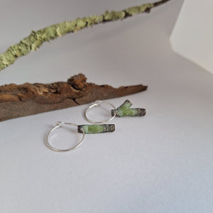 Frosted or blackened sterling silver hoop earrings with domed lichen cup or green powder coated details inspired by lichens on forest trees. Handmade in Tasmania by Karen Visagie from Hulley Jewellery