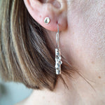 Load image into Gallery viewer, Frosted or blackened sterling silver hoop earrings with domed lichen cup or green powder coated details inspired by lichens on forest trees. Handmade in Tasmania by Karen Visagie from Hulley Jewellery
