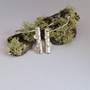 Frosted or blackened sterling silver hoop earrings with domed lichen cup or green powder coated details inspired by lichens on forest trees. Handmade in Tasmania by Karen Visagie from Hulley Jewellery