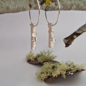 Frosted or blackened sterling silver hoop earrings with domed lichen cup or green powder coated details inspired by lichens on forest trees. Handmade in Tasmania by Karen Visagie from Hulley Jewellery