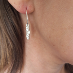 Load image into Gallery viewer, Lichen branch twig hoop earring frosted sterling silver on ear

