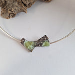Load image into Gallery viewer, Oxidised blackened sterling silver forest lichen inspired necklace on a extendable omega chain with bark texture and green powder coated lichens
