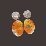 Load image into Gallery viewer, Recycled sterling silver sunburst  dangle statement lichen earrings on a rock.
