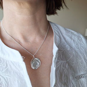 Sterling Silver organic shaped and textured beach boulder inspired necklace handmade in Tasmania by Karen Visagie from Hulley Jewellery